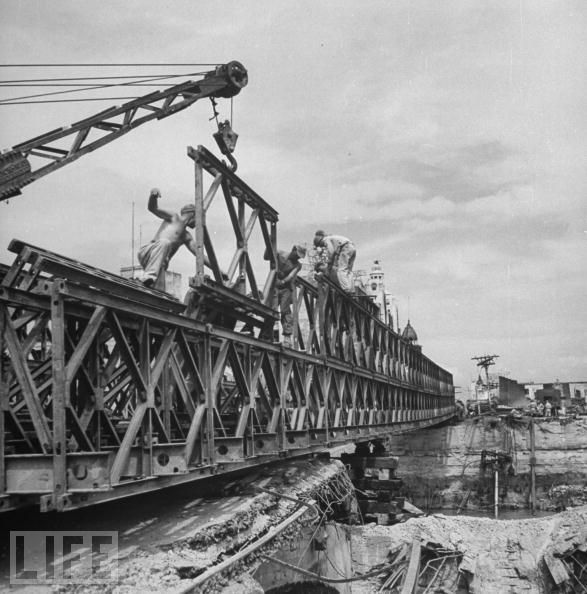 Building a more permanent bridge to replace an earlier log bridge